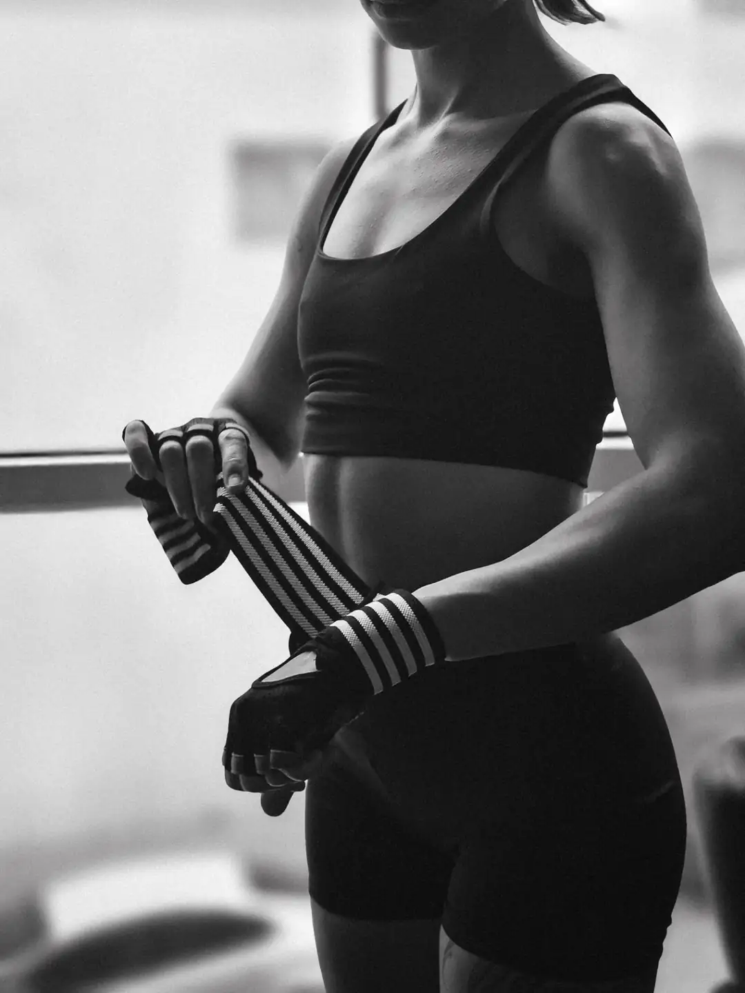 Athlete wrapping wrists before training